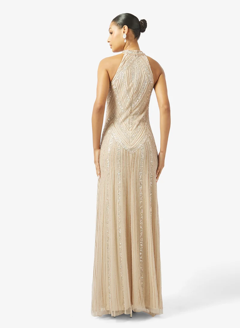 نمشي x فستان سهرة مزين بالخرز بياقة هالتر